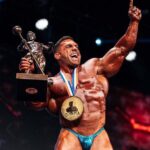 Mr Olympia 2025 winners on stage holding trophies